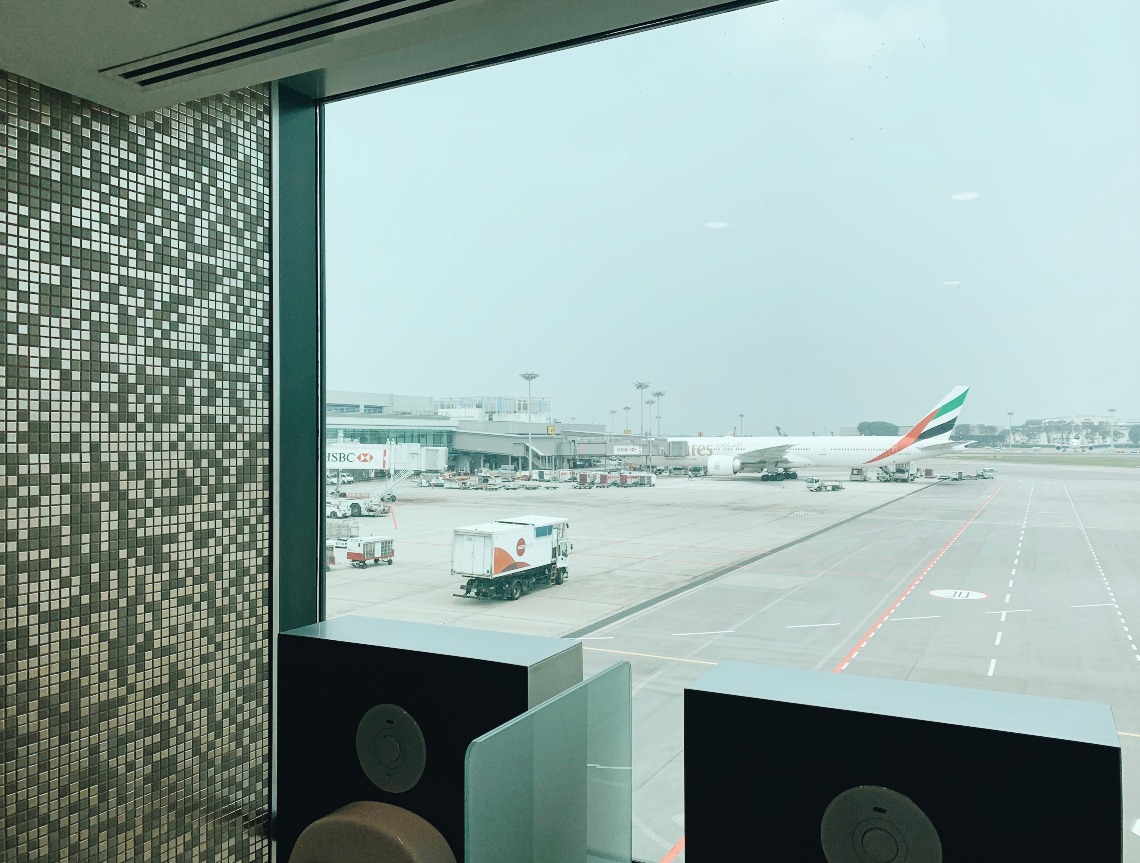 A toilet at Changi with a view of planes
